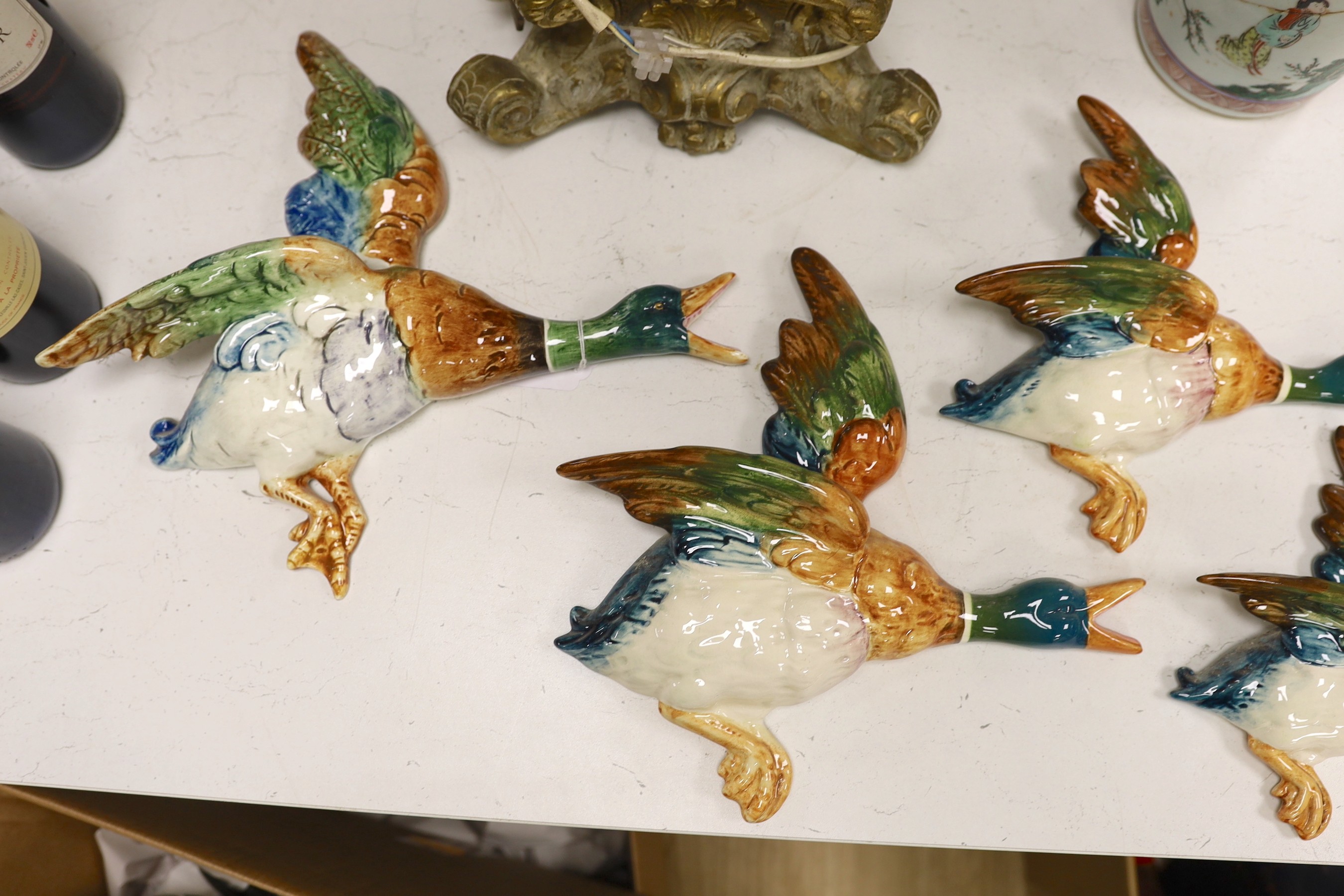 A set of five graduated Beswick porcelain flying ducks and two others by Royal Dux and Shorter.